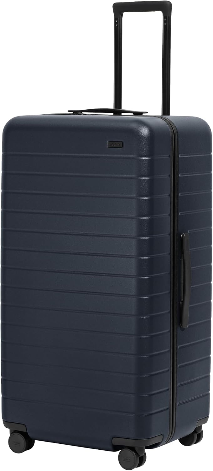 image:imageAway Amazon Exclusive Large Checked Luggage 29Inch Lightweight Hardside Suitcase with Four WhisperGlide 360 Spinner Wheels Interior Compression System TSAAccepted Lock Sky BlueNavy Blue